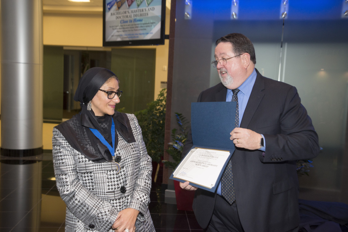 Collin College Professor Dr El-Ashmawy receiving award